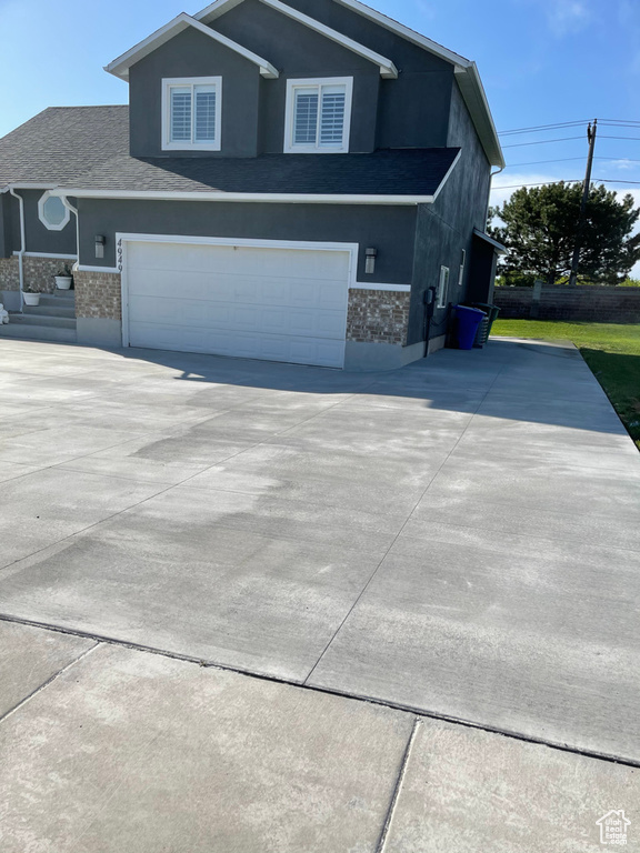 View of front of home featuring a garage