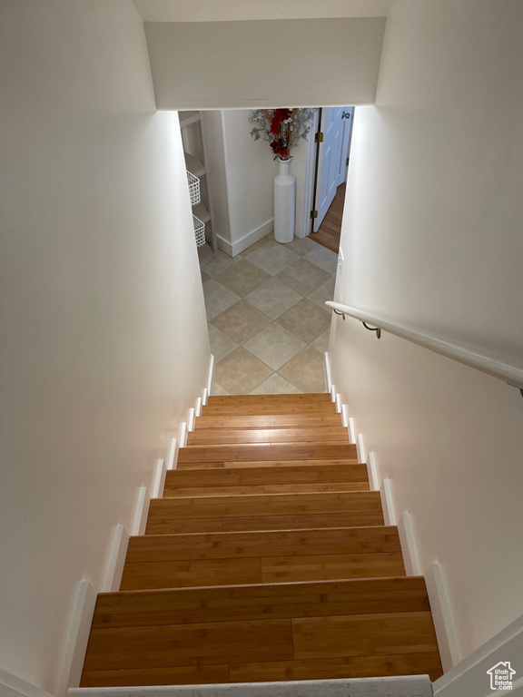 Stairway with hardwood / wood-style flooring