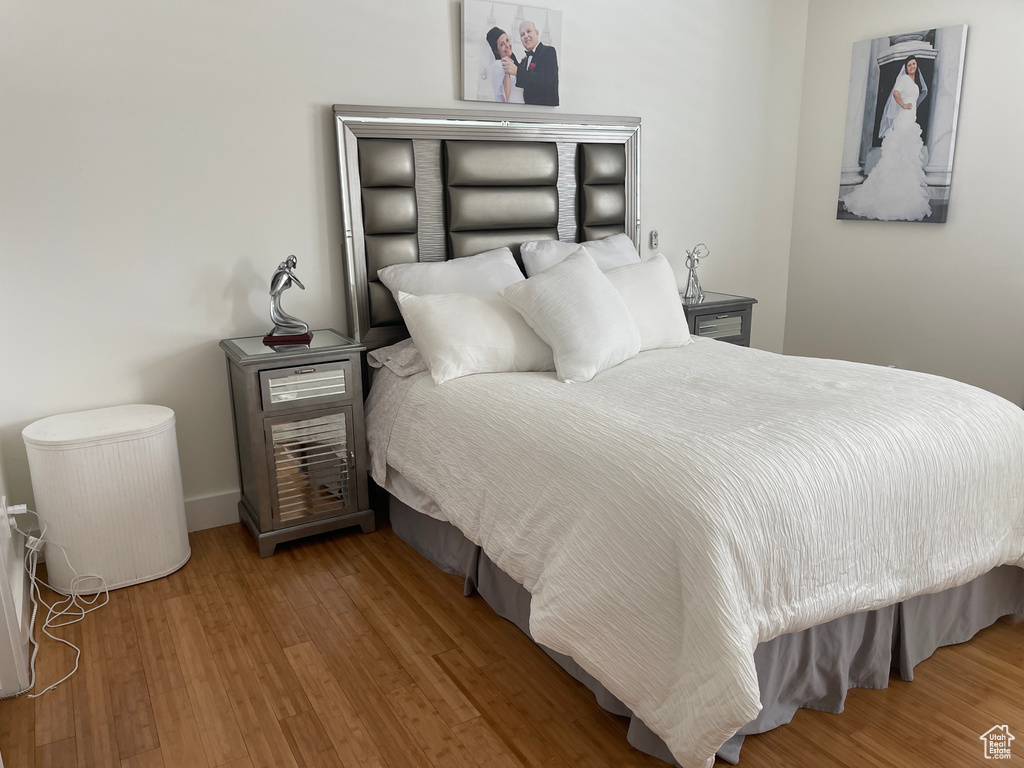 Bedroom with wood-type flooring