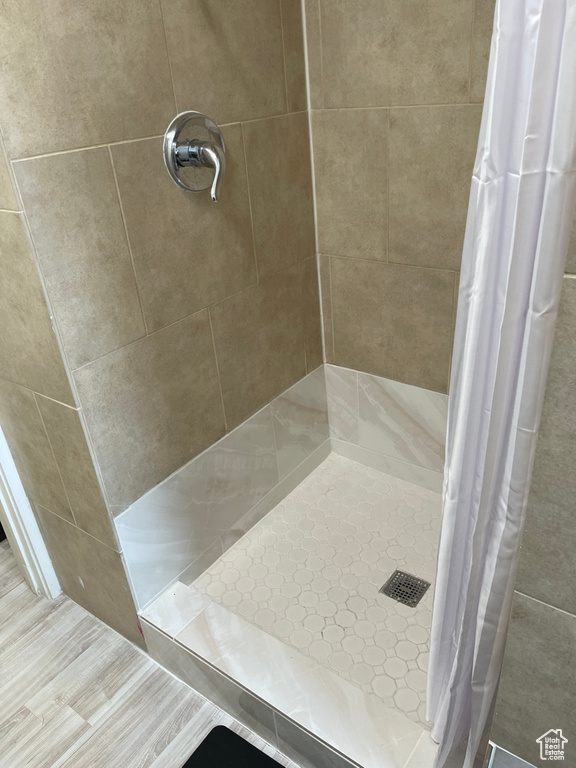 Bathroom featuring a shower with curtain