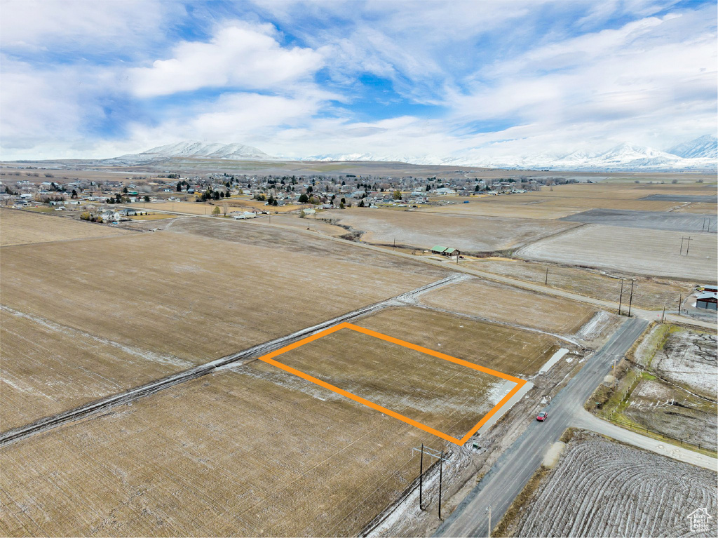 Birds eye view of property with a mountain view and a rural view