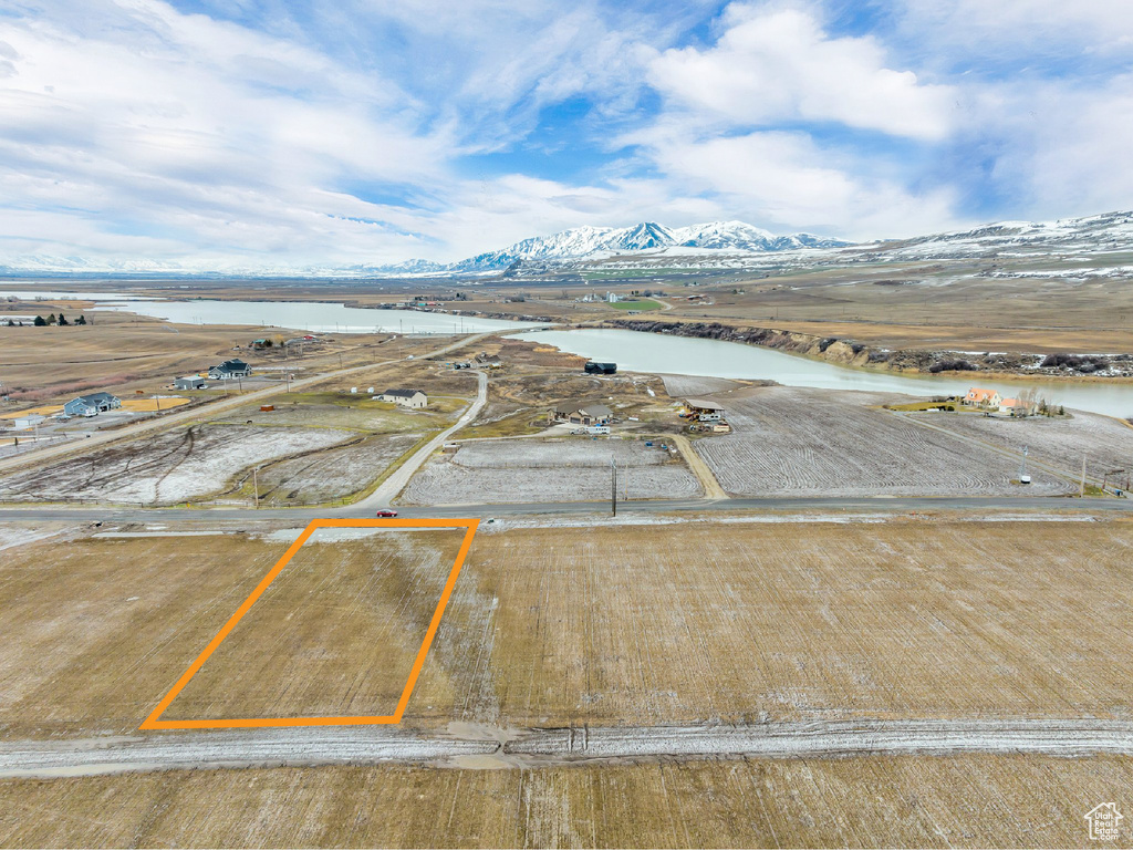 Drone / aerial view with a water and mountain view