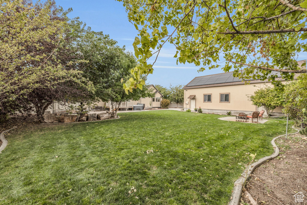 View of yard with a patio area