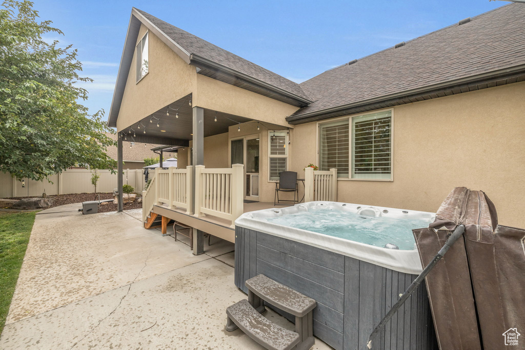 Exterior space with a hot tub