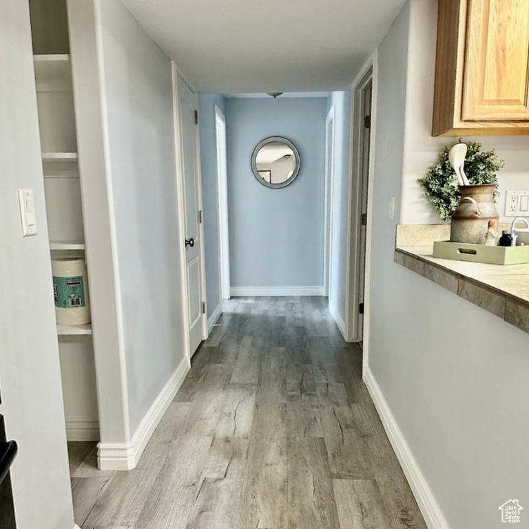 Hallway with light wood-type flooring