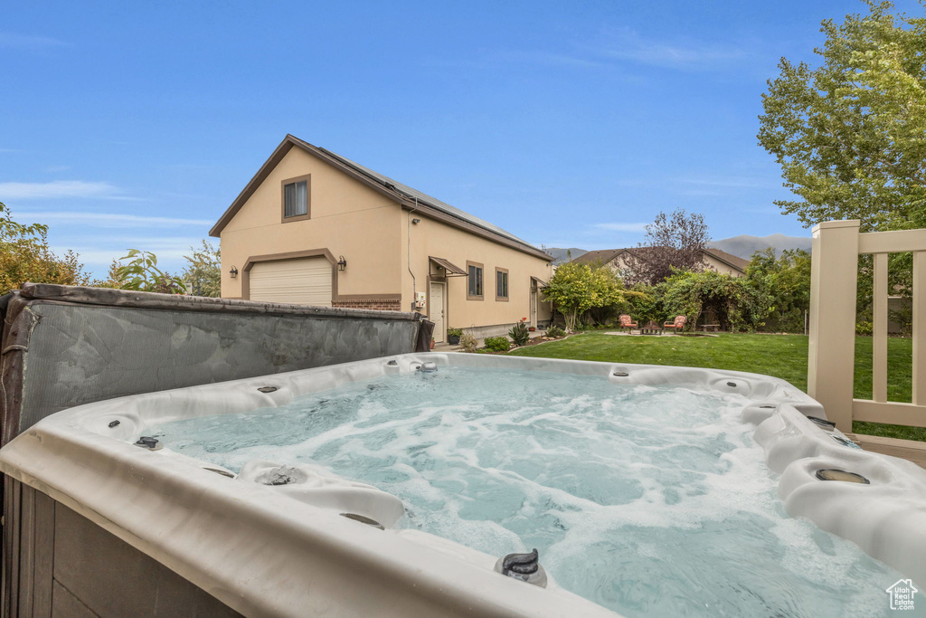 Exterior space with a hot tub