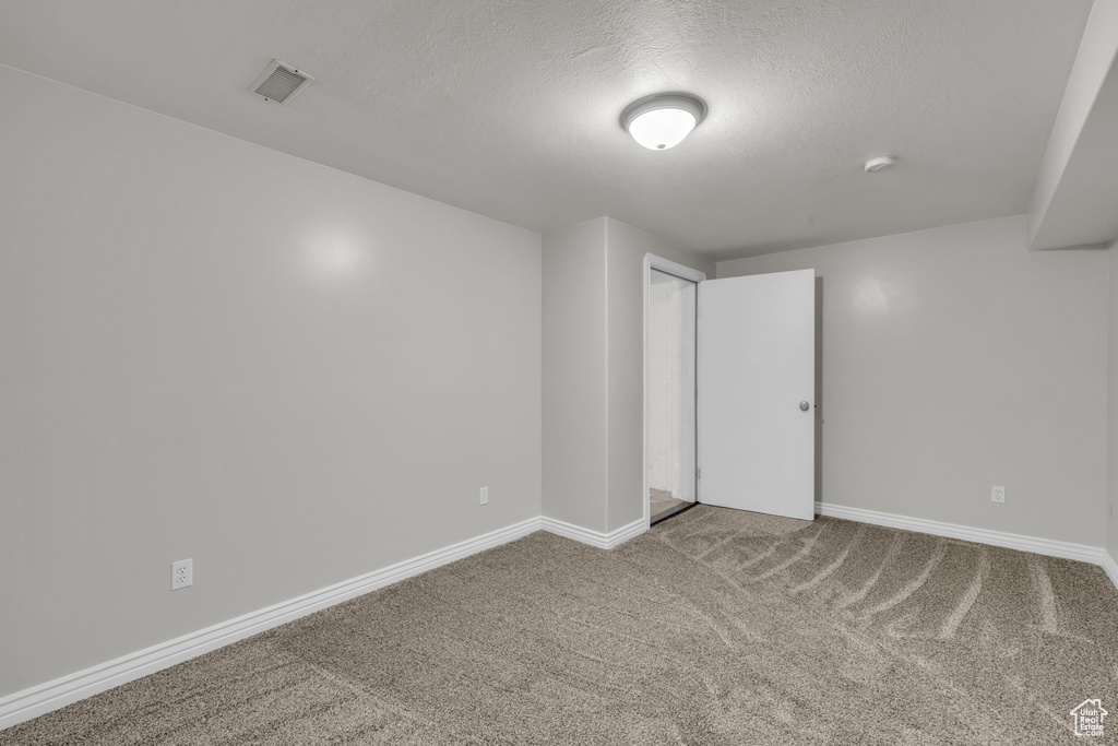 Interior space featuring a textured ceiling