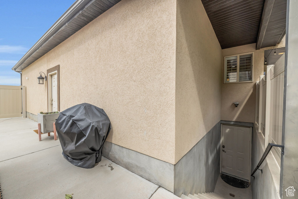 View of side of home with a patio area