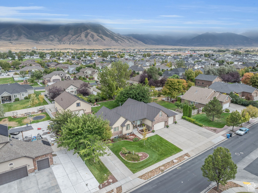 Birds eye view of property with a mountain view