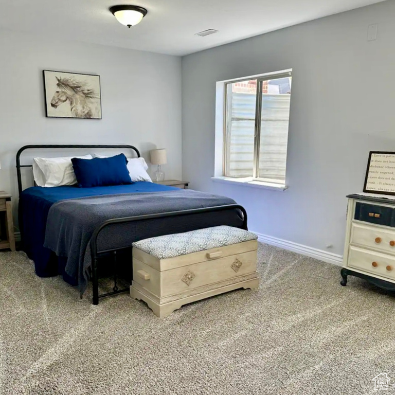 Bedroom featuring carpet