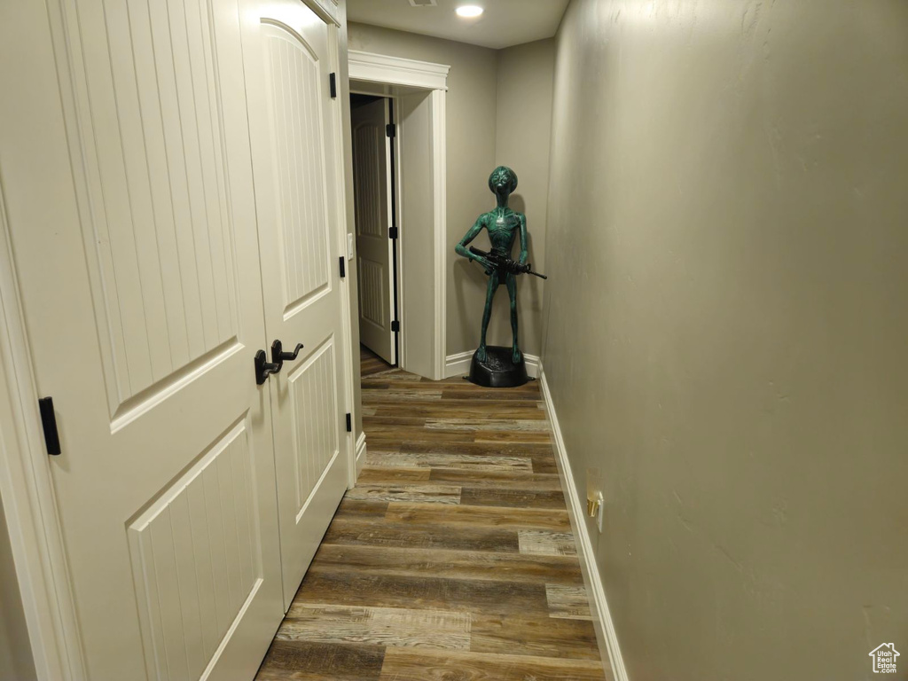 Hallway featuring dark wood-type flooring