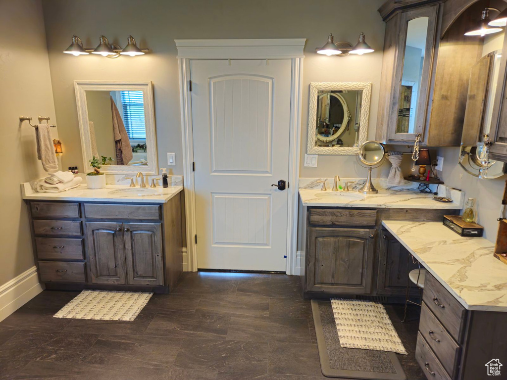 Bathroom featuring vanity and hardwood / wood-style floors