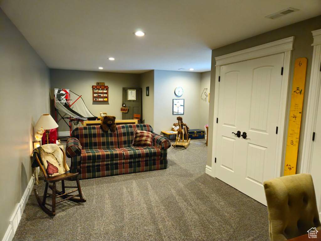 Living room with dark colored carpet