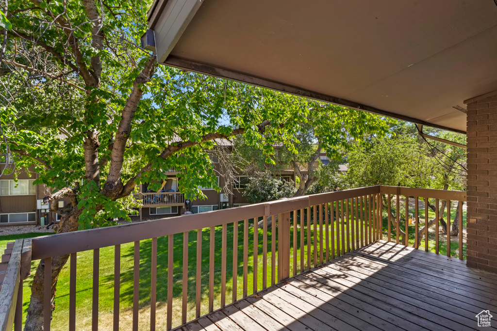 Deck featuring a lawn