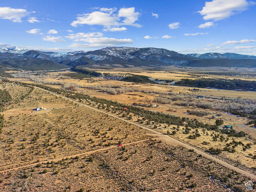 Birds eye view of property with a mountain view