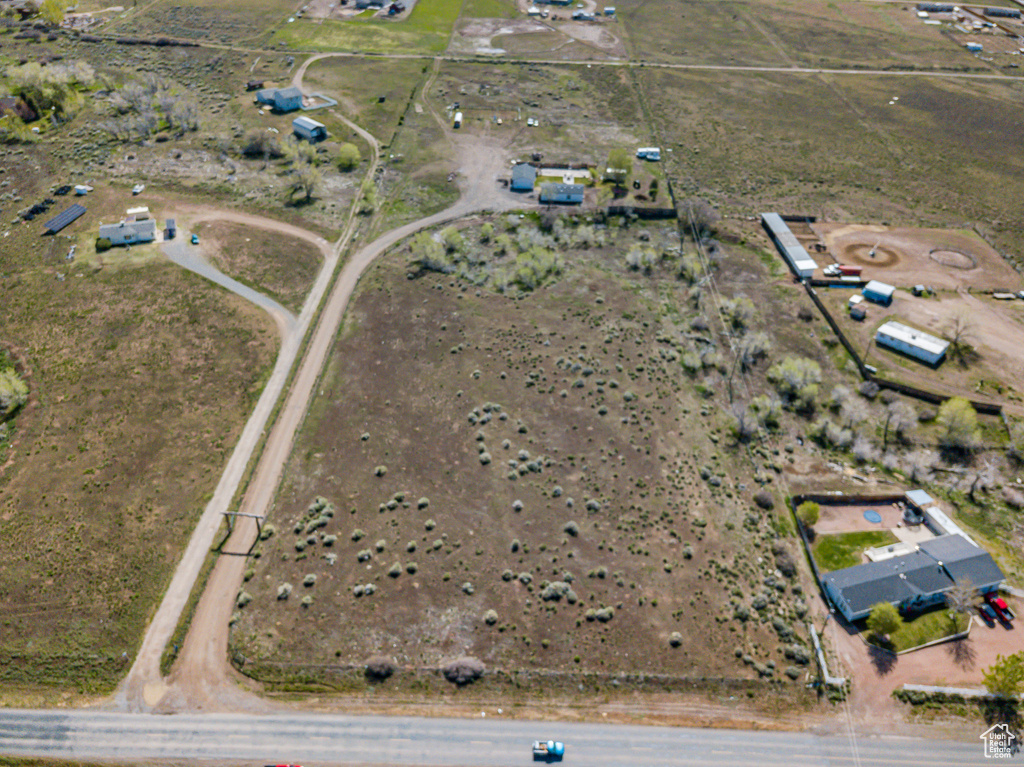 Birds eye view of property featuring a rural view