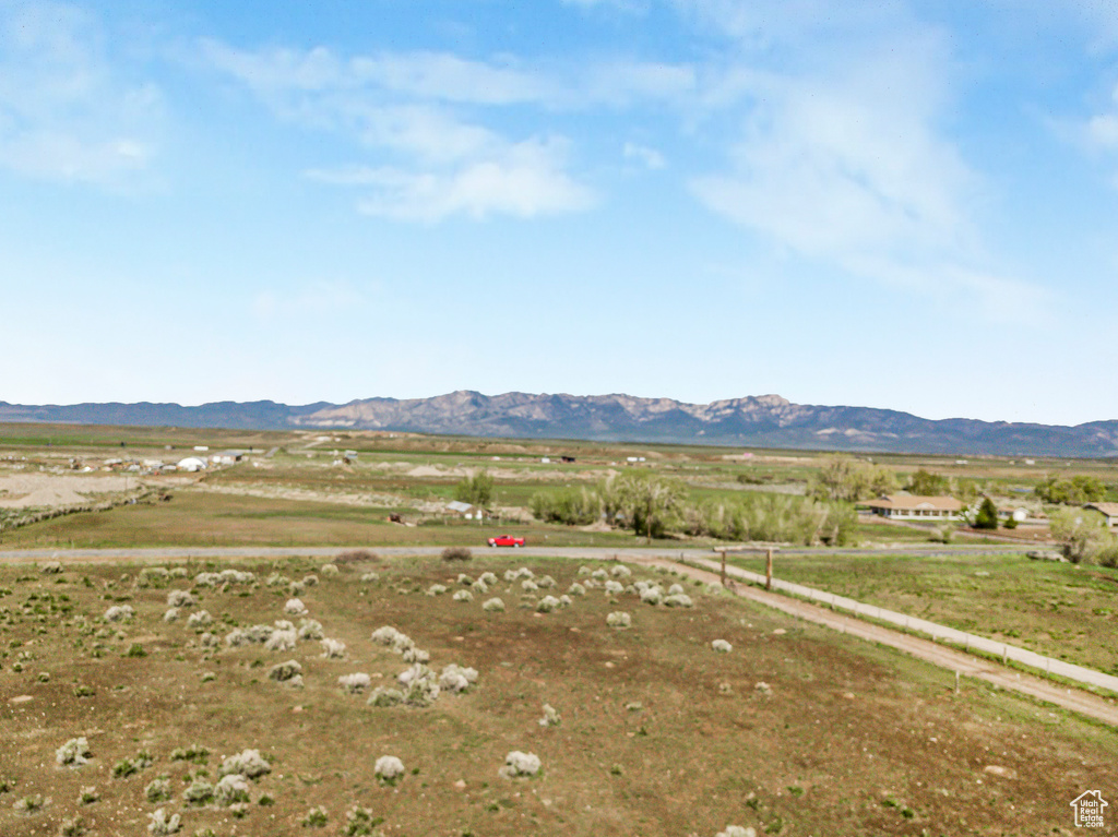 Property view of mountains with a rural view