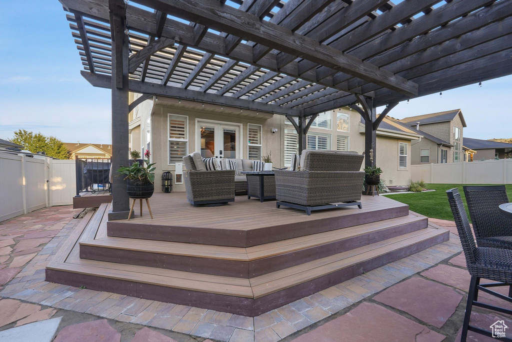 View of patio featuring an outdoor living space, a deck, and a pergola