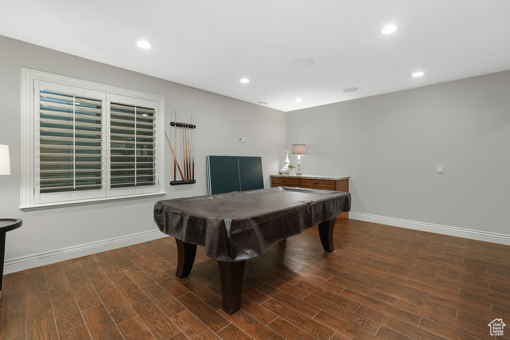 Recreation room with dark hardwood / wood-style floors and billiards