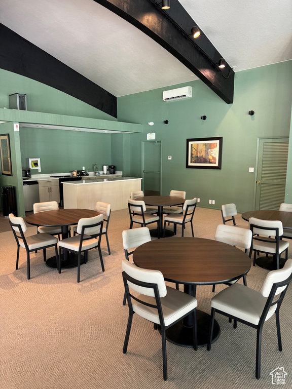 Dining space with light carpet, beamed ceiling, and high vaulted ceiling