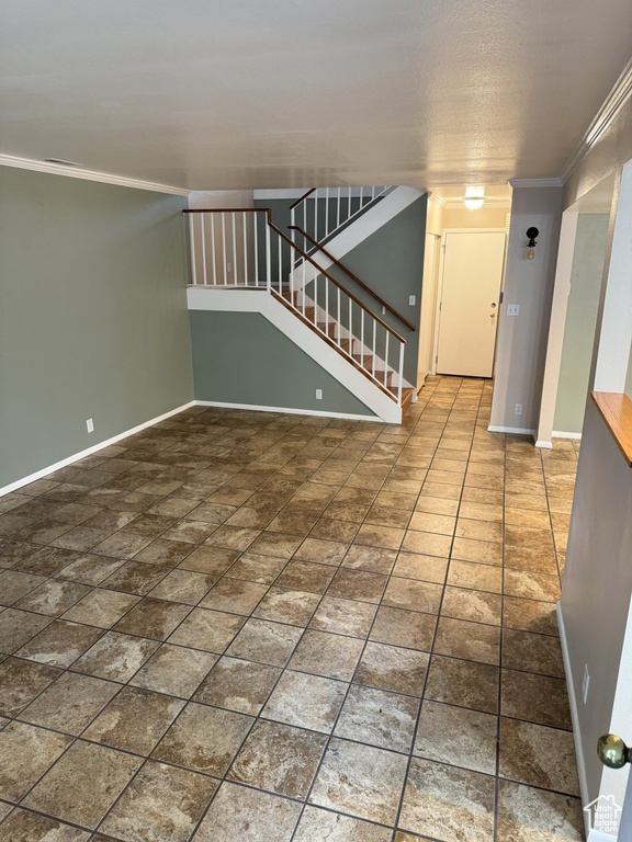 Spare room featuring crown molding