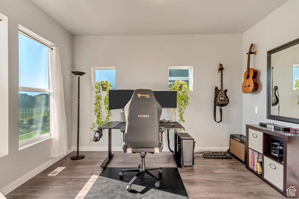 Workout room with light wood-type flooring