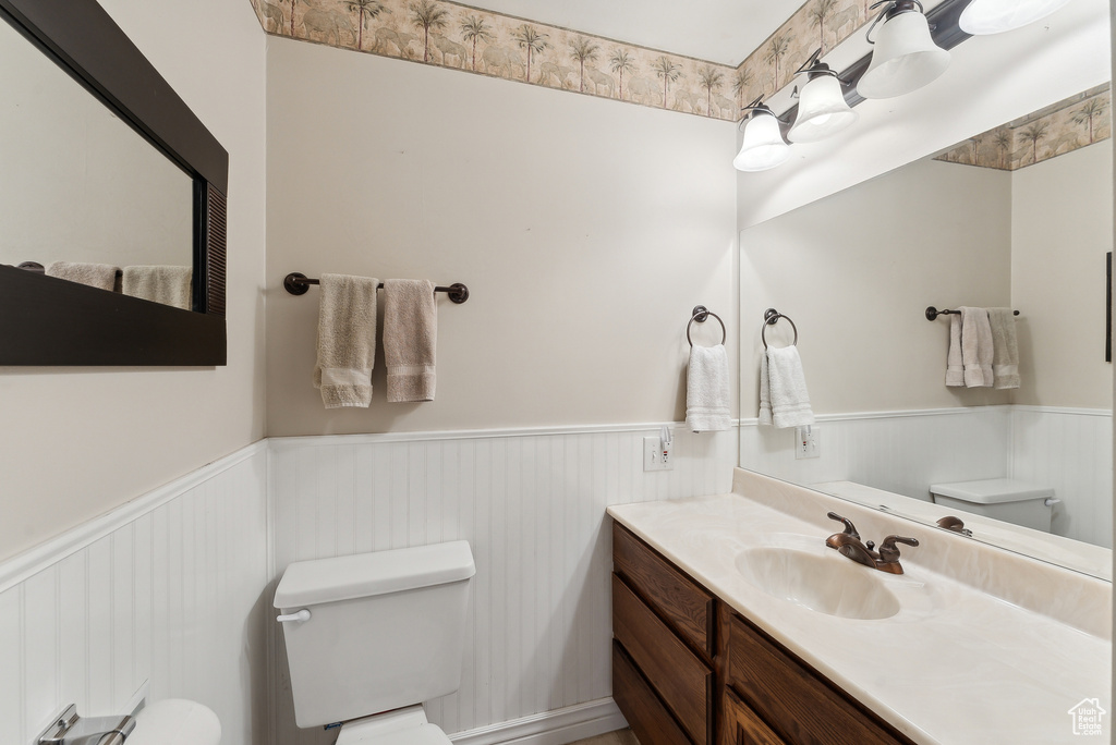 Bathroom featuring vanity and toilet