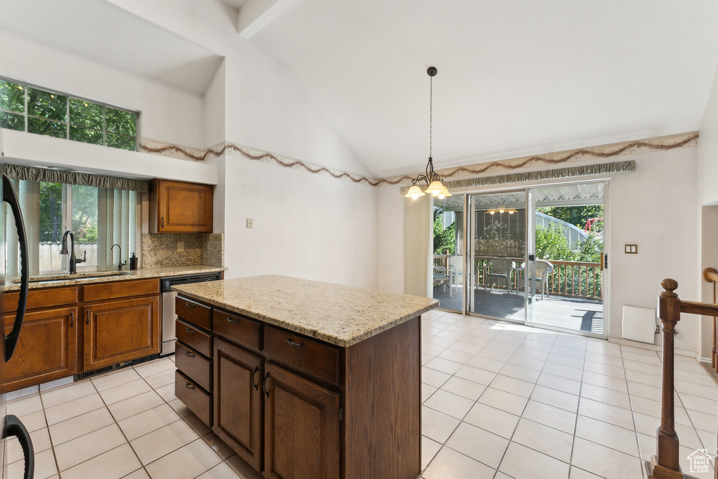 Kitchen featuring light tile patterned flooring, high vaulted ceiling, stainless steel dishwasher, and a center island