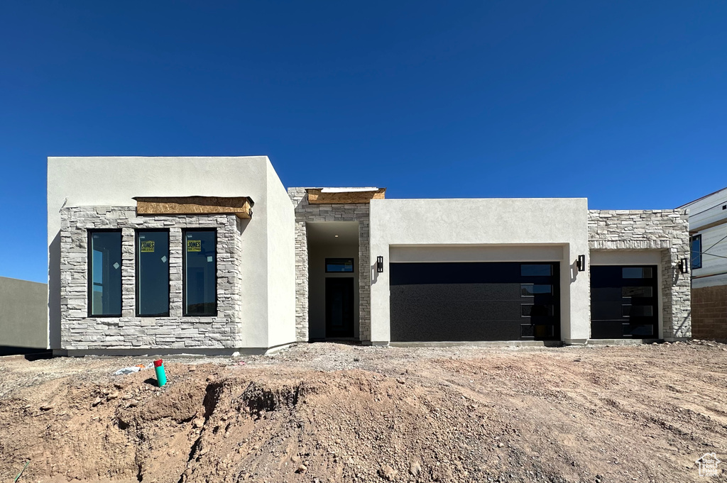 View of front of home featuring a garage