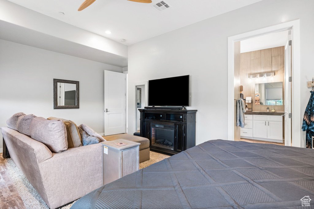 Bedroom with connected bathroom and ceiling fan