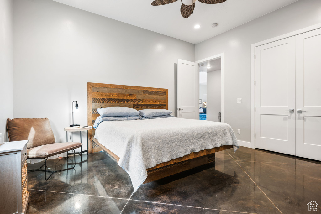 Bedroom featuring ceiling fan and a closet