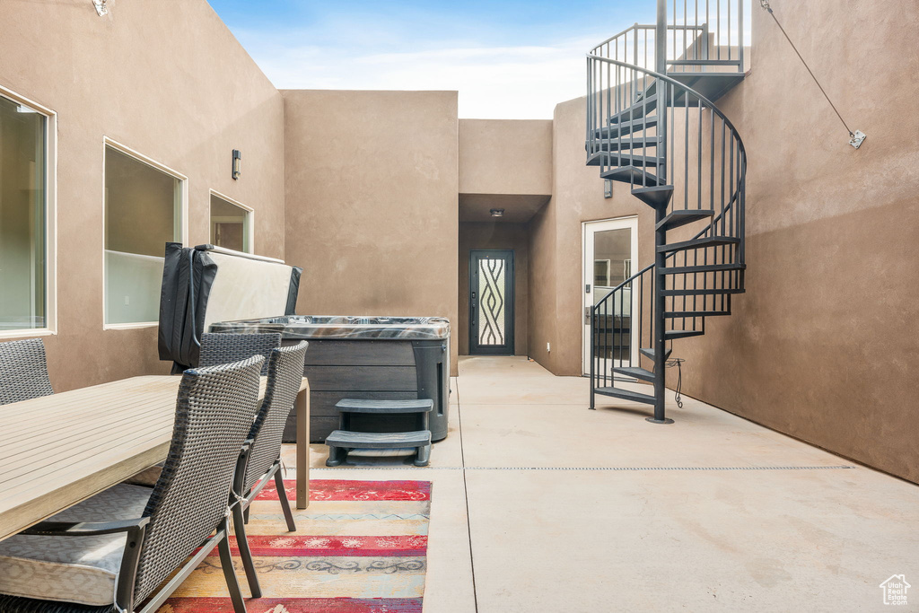 View of patio / terrace featuring a hot tub