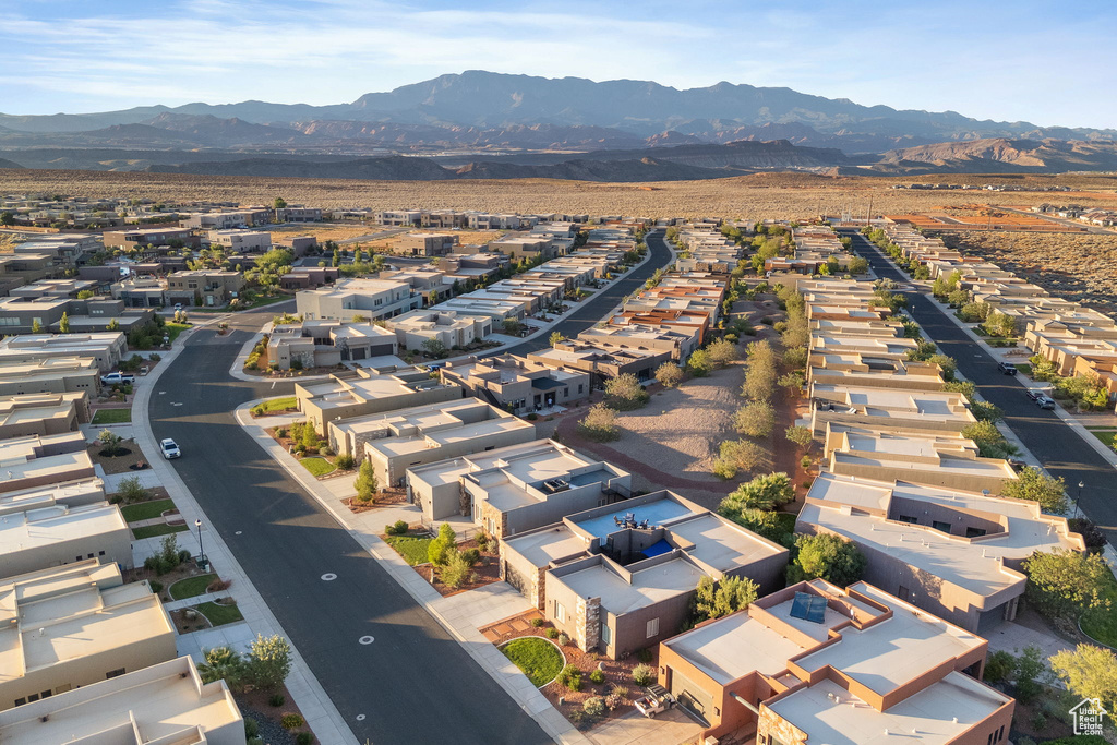 Birds eye view of property with a mountain view