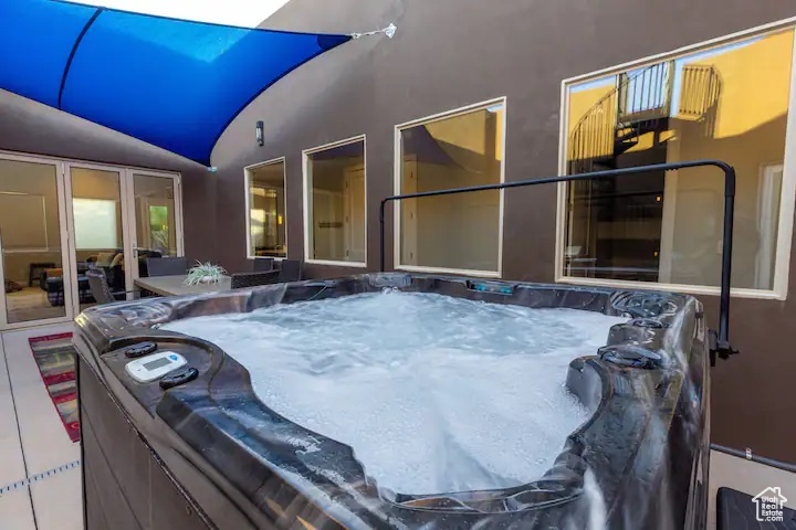 View of patio / terrace featuring a hot tub