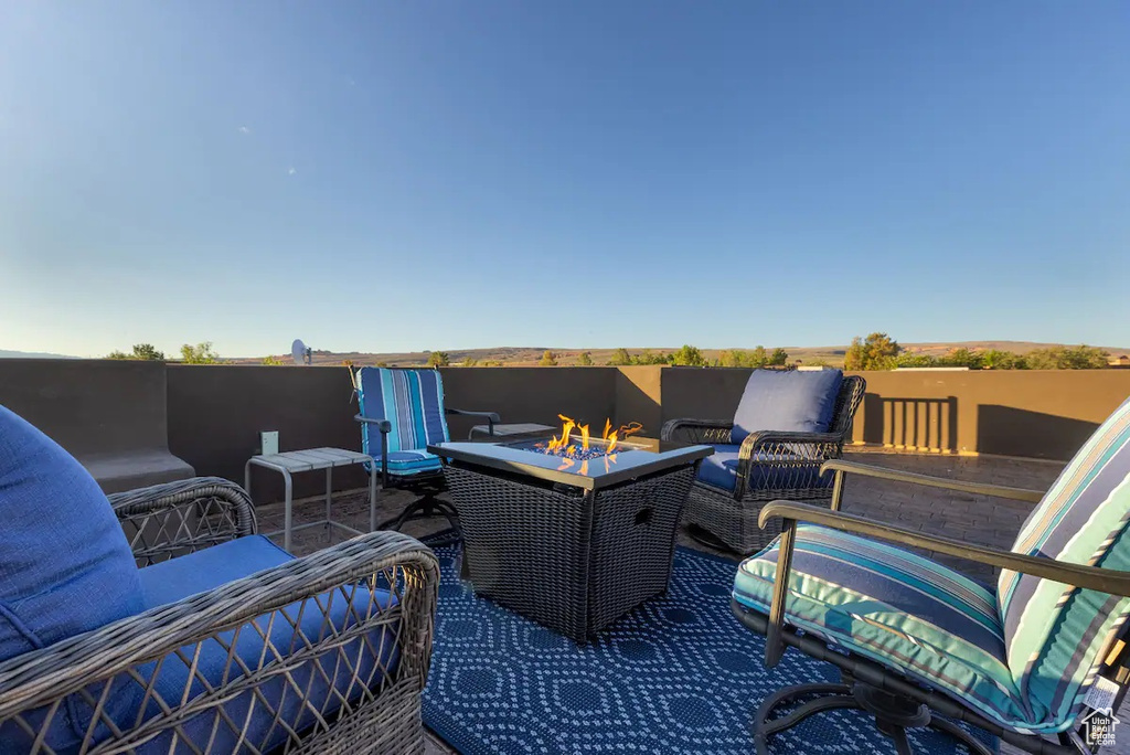 View of patio / terrace featuring an outdoor living space with a fire pit