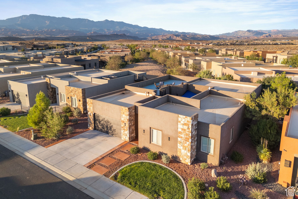 Birds eye view of property with a mountain view