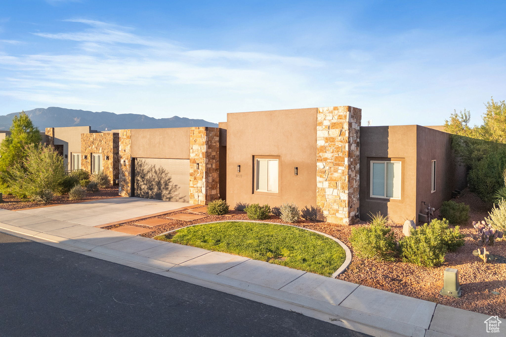 Pueblo-style home with a mountain view