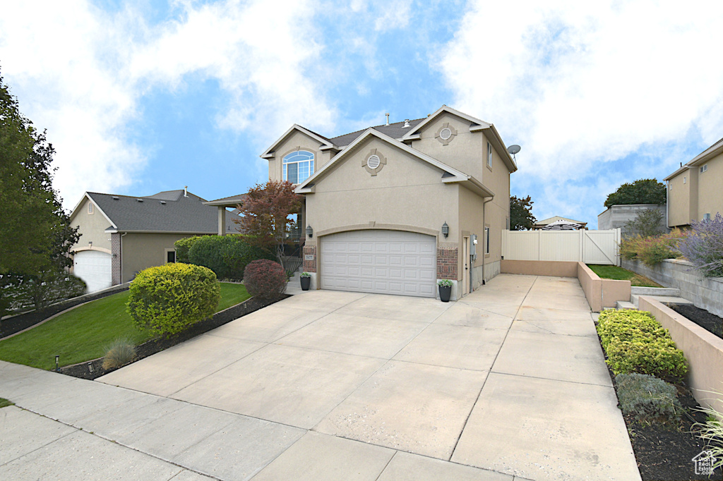 View of front of property with a garage