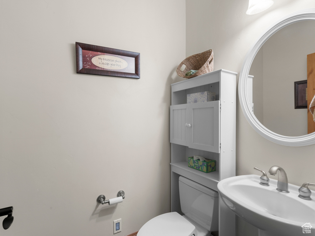 Bathroom featuring toilet and sink