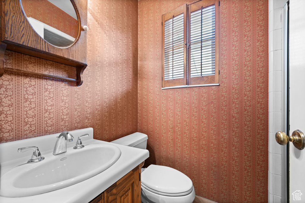 Bathroom with vanity and toilet