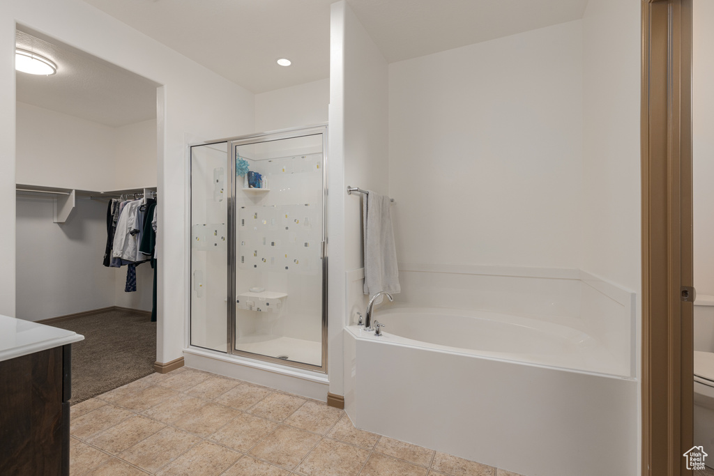 Bathroom with vanity and independent shower and bath