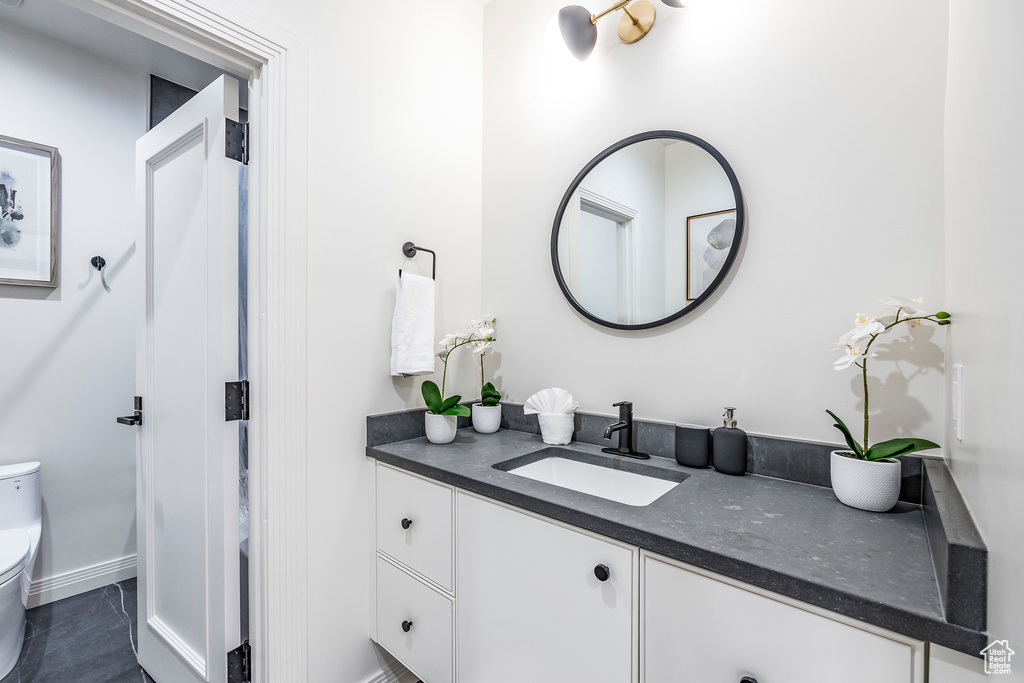 Bathroom featuring vanity and toilet