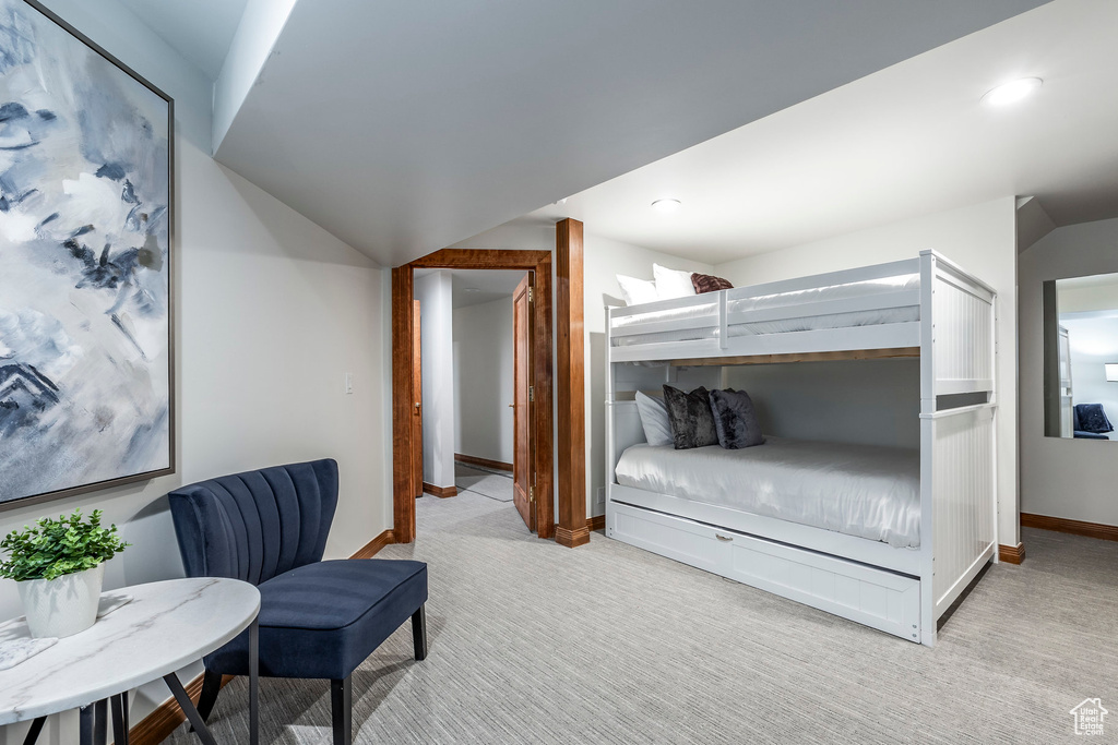 Bedroom with light colored carpet