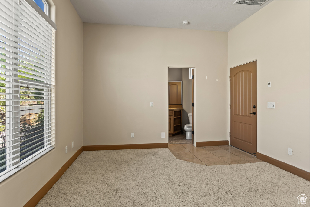 Unfurnished room with light carpet