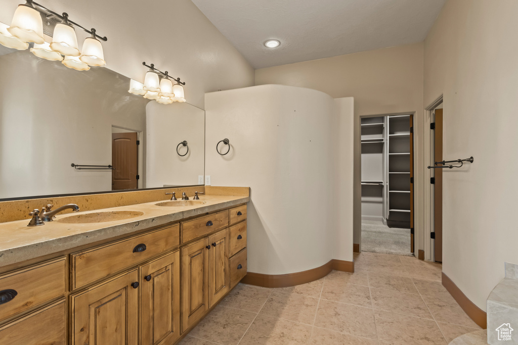 Bathroom featuring vanity and tile patterned flooring