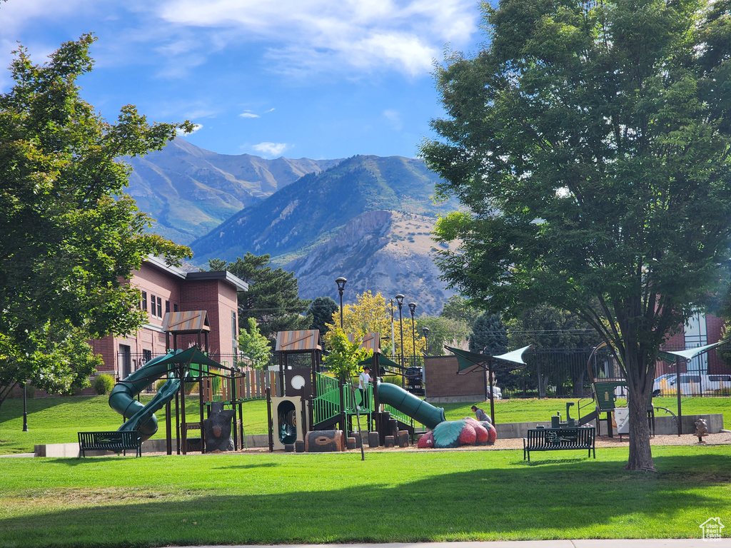 View of play area featuring a lawn and a mountain view