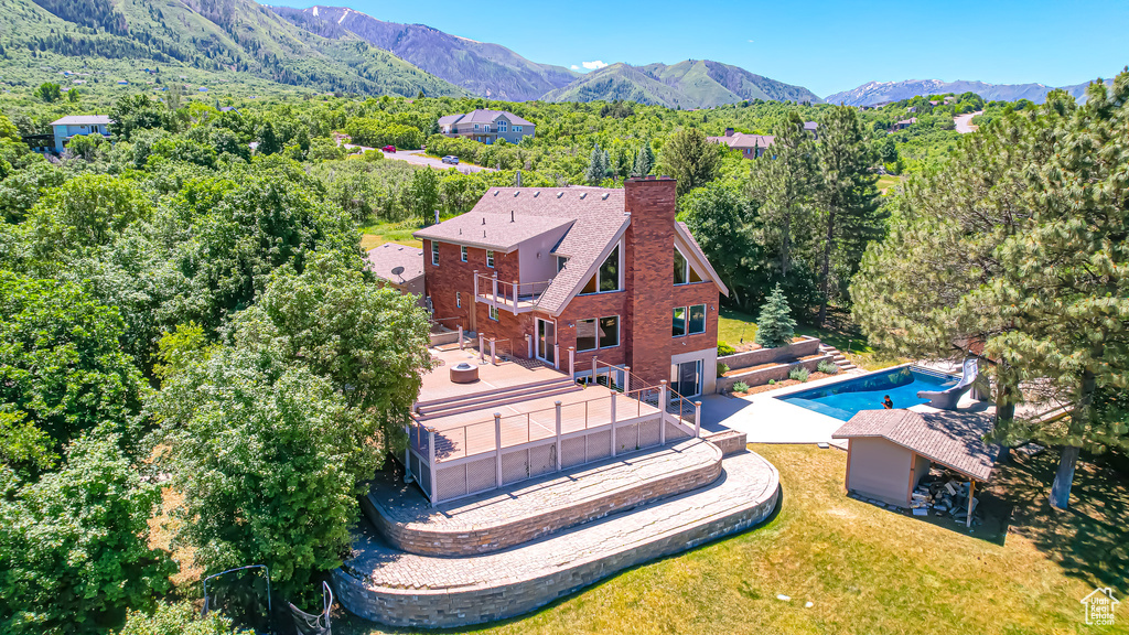 Birds eye view of property with a mountain view