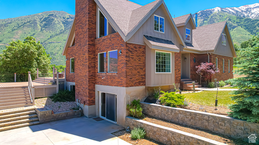 View of side of property featuring a mountain view