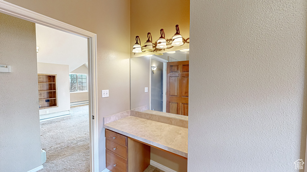 Bathroom with a baseboard heating unit