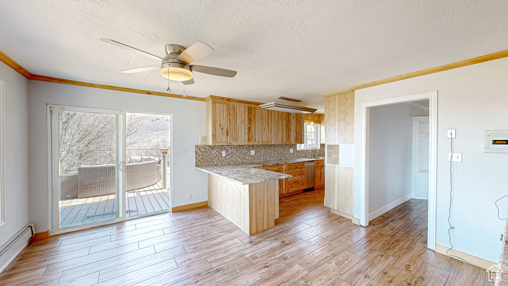 Kitchen featuring ceiling fan, sink, light hardwood / wood-style flooring, dishwasher, and a baseboard radiator